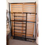 A metal framed double bed, with wooden slats, brass fittings, 132cm wide.