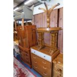 A yew wood finish drinks cabinet, coffee table, nest of three tables, a G-Plan oak chest of four dra