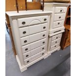 Cream bedroom furniture, a six drawer Wellington chest, and two pedestal cabinets.