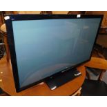 A Panasonic TX-P42X50B 42" colour television, in black trim with remote control, wire and instructio