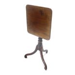 A 19thC mahogany occasional table, the square tilt top, on a turned column on three down swept legs,