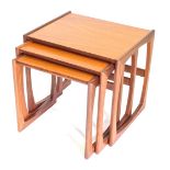 A nest of three G-Plan teak tables, each on plain end supports, 55cm wide.