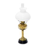 A late 19th/early 20thC brass oil lamp, with central column, ceramic base and opaque shade, 75cm hig