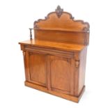 A Victorian mahogany chiffonier, the raised back with a single shelf, on turned supports, the base w