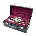 A Besson Academy Class A cornet, with three valves, 37cm long. (cased)