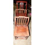 A Chinese red lacquered child's chair, with three carved panels, and two slatted child's chairs. (3)