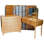 A late 50/60's part walnut bedroom suite, comprising dressing table with triple mirror and four draw