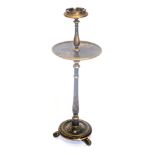 An early 20thC black red and gilt Japanned smoker's stand, with turned column, domed foot, and ball