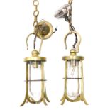 A pair of brass lanterns with hook tops, 33cm high (2)