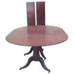 A George III three pillar dining table, the reeded top having two D ends, with ebony stringing, sept