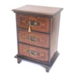 A Continental inlaid mahogany side cabinet, the rectangular top with a moulded edge above three inla