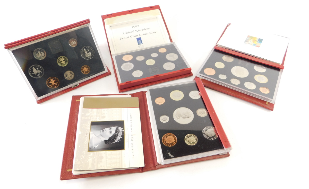 Various Royal Mint deluxe coin proof sets, 1990, 2002, 1998, 1992 (4)