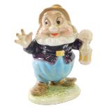 A Beswick Snow White dwarf Happy, number 1386, gold oval mark, 11cm high.