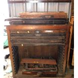 A late 19thC John Haddon and Company pine cased compositor's chest, containing various drawers with
