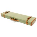 A Brady green fabric and tan leather bound gun case, 78cm wide.