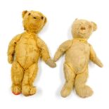 A Merrythought teddy bear, with a long snout, jointed arms and legs, 43cm high, and a straw filled t