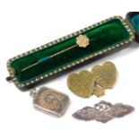 A Victorian 9ct gold tiepin, with engraved decoration, cased, 0.7g, together with a Victorian silver