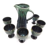 A late 20thC Woburn pottery water set, with mottled green above blue glaze, impressed marks, compris