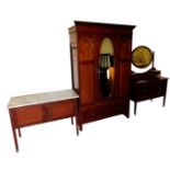 An Edwardian mahogany and inlaid double wardrobe, the outswept pediment over a central door inset be