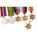 A group of six World War II medals, comprising Defence medal, 1939-1945 War medal, Africa Star (x2),