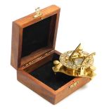 An FL West brass nautical compass, wooden boxed.