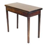A George III mahogany fold over tea table, raised on tapering square legs, 74cm high, 86cm wide, 39c