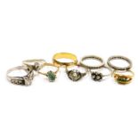 Nine dress rings, some gem set, including diamonds, in gold and silver, and unmarked metal.