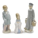 Three Lladro porcelain figures, comprising a boy in a dressing gown with a stool behind, Dutch boy h