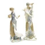 A Lladro porcelain figure of a boy with a kid goat, wrapped around his shoulders, 28cm high, and a f