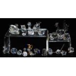A group of Swarovski and other crystal ornaments, including a hippopotamus, squirrel, standing cat,