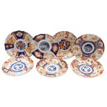 Seven Meiji period Japanese porcelain Imari plates, each of scalloped form, each variously decorated