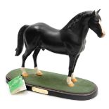 A Beswick matt black figure of Welsh Cobb Stallion, raised on an oval base, printed mark.