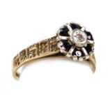 A 9ct gold sapphire and diamond flower head ring, in a basket setting, with engraved shoulders, size