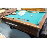 A slate bed mahogany framed pub pool table, with cues, balls, triangle, and cover.