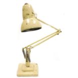 A Herbert Terry and Sons Limited cream Anglepoise lamp. (AF)