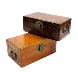 Two late 19thC Oriental leather trunks, each with brass ring handles and lock plate, 32cm wide and 3