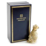 A Halcyon Days porcelain and silver gilt mounted scent bottle, modelled as a leopard, 8cm high, asso