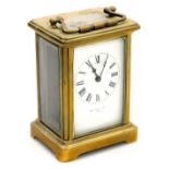 A late 19thC brass cased carriage clock, rectangular enamel dial bearing Roman numerals, single barr