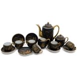 A Japanese porcelain coffee service, decorated in gilt on a brown ground, comprising coffee pot, suc