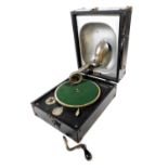 A Decca Junior Portable tabletop gramophone, for Farmers, the Music House, Nottingham, 24cm wide, 31