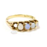 An 18ct gold and opal five stone ring, in a claw mount, size M, 2.5g. (AF)