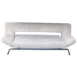 An Italian modern cream suede two seater sofa, with a drop down back, raised on metal supports 182cm