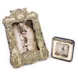 An early 20thC silver plated strut photograph frame, of military interest, embossed with soldiers, a