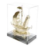 A Middle Eastern white metal model of a Dhow, converted to a table lamp, within a Perspex case, case