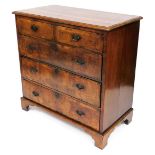 A George II walnut chest, of two short over three long drawers, raised on bracket feet, 98cm high, 9