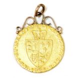 A George III gold spade guinea 1795, with a rose metal pendant mount, 9.0g.