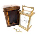 An early 20thC brass cased carriage clock, rectangular enamel dial bearing Roman numerals, single ba