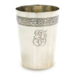 A late 19thC Continental beaker, white metal, decorated with a band of laurel leaves, tied at interv
