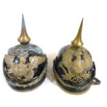 Two early German Pickelhaubes, one bearing crest for Colberg 1307, the other with the Prussian Eagle