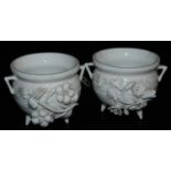 A pair of late 19thC Stevenson and Hancock Derby porcelain salts, of white glazed cauldron form, enc